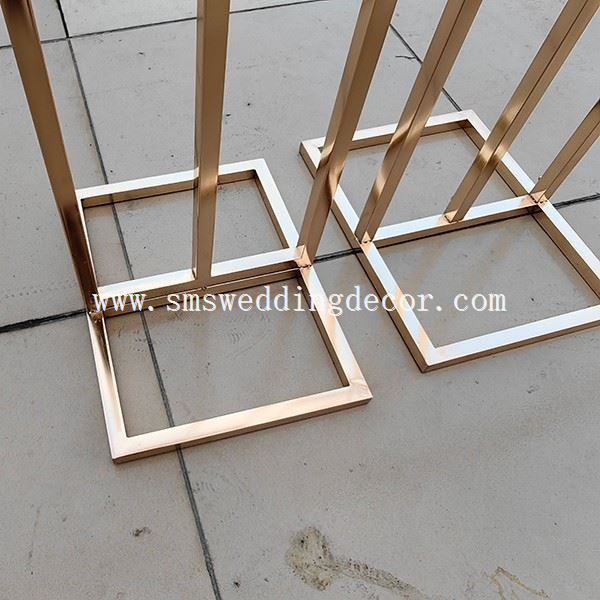 gold metal arch stand
